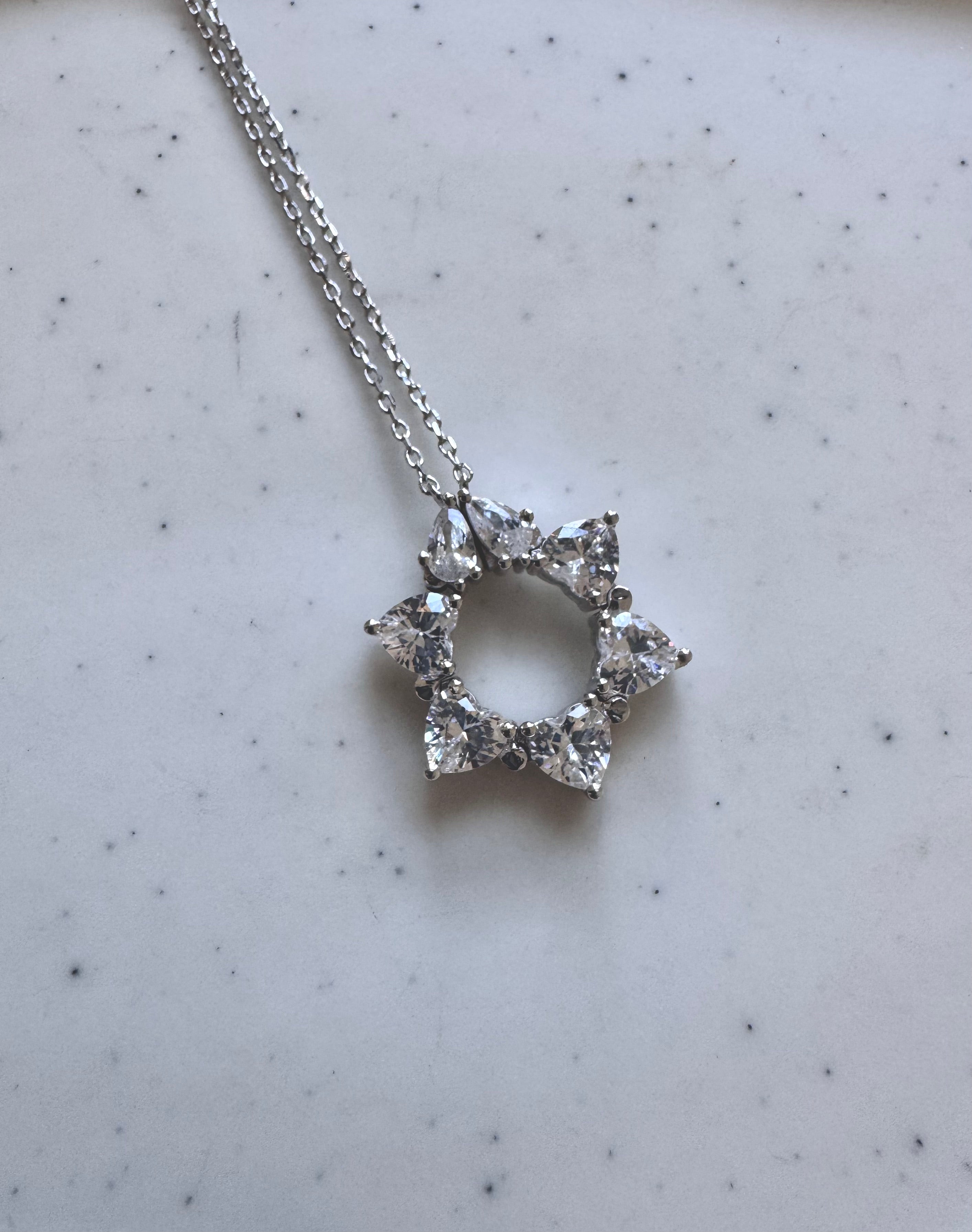 โAhavat Yisrael
, Star of David that Opens into Hearts Necklace, white CZ.