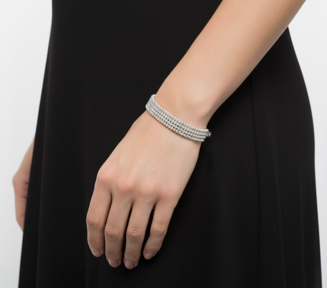 Hard bracelet 4 rows of diamond cut beads