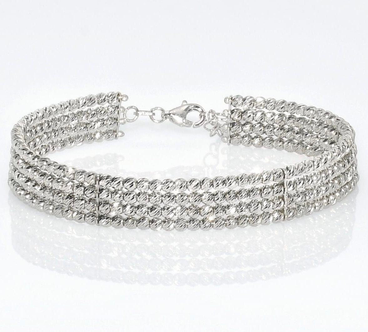 Hard bracelet 4 rows of diamond cut beads