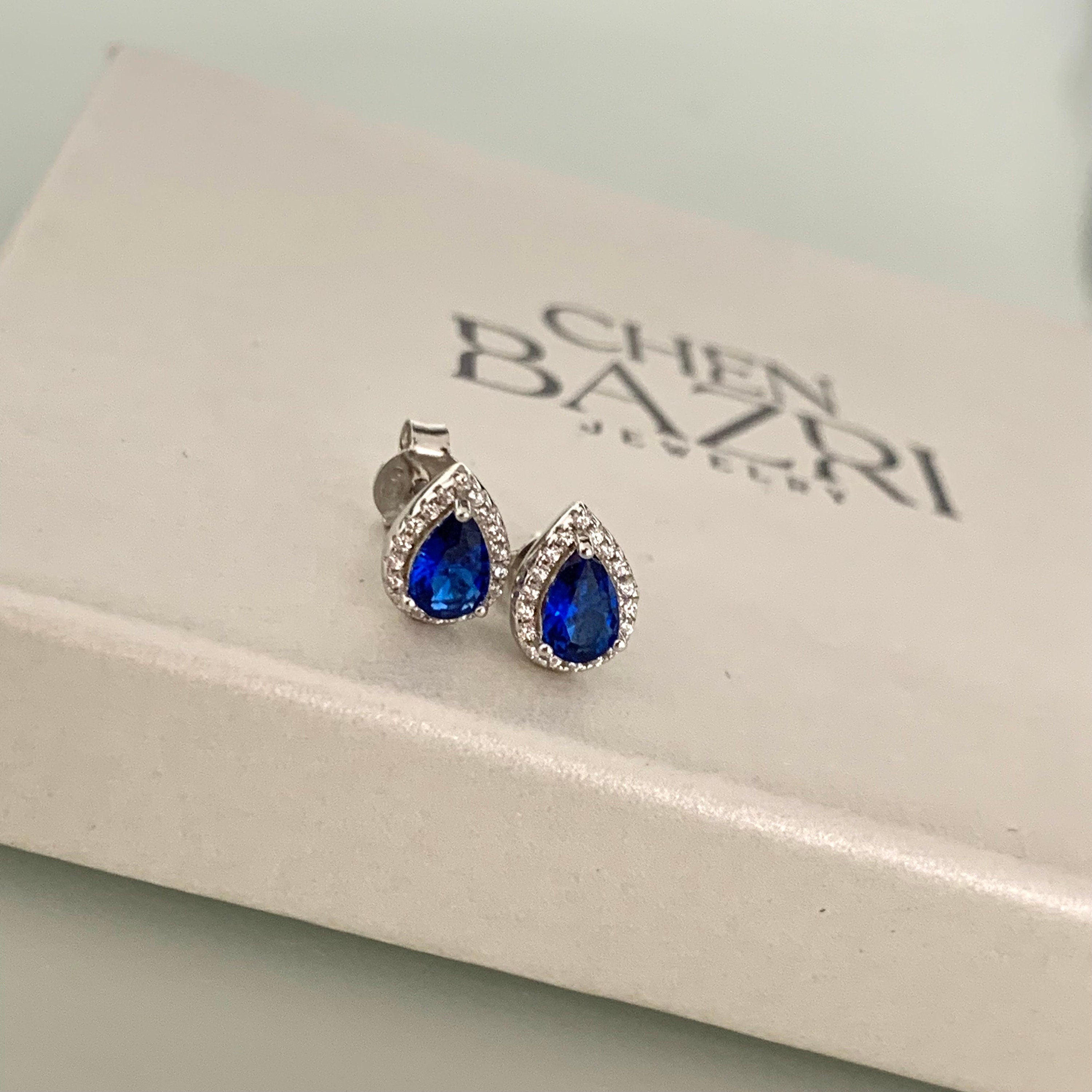 Drop earrings with a blue stone